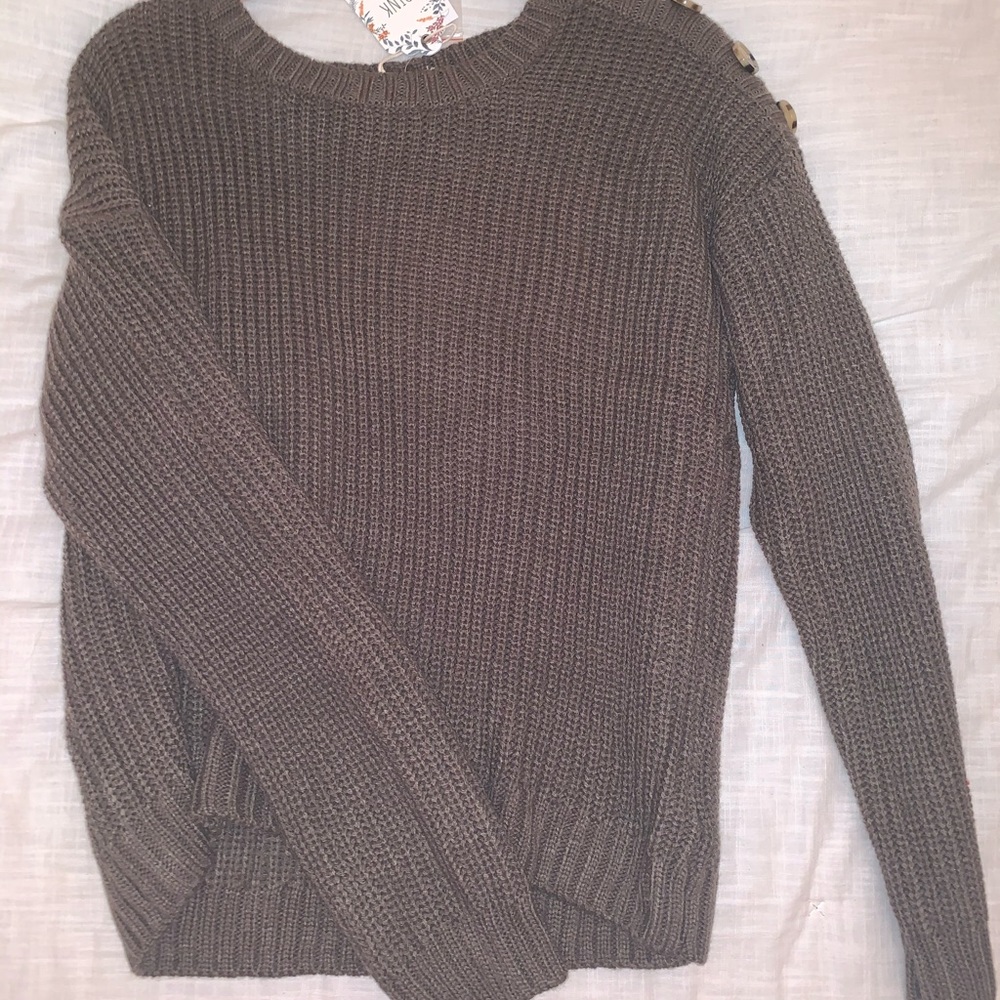 a cute top with buttons on the side